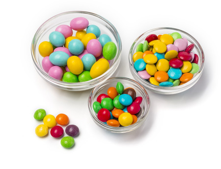 Colorful chocolate candy pills isolated on white background.
