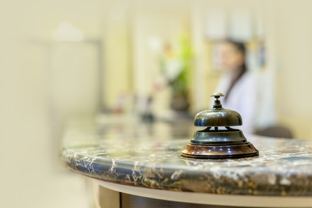 Modern luxury hotel reception counter desk with bellの写真素材