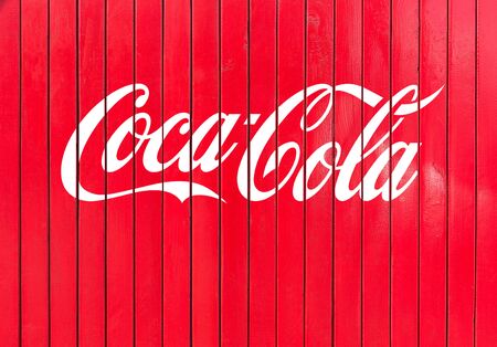 Brasov, Romania - April, 22, 2017:The inscription of Coca Cola on the red planks