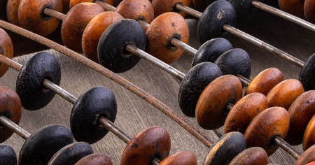 Close-up macro photo of vintage abacus for calculationの写真素材