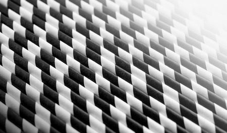Background of Striped drink straws in black and white  colorsの写真素材