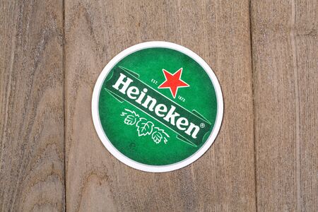 Chisiinau, Moldova - January 18, 2019: Beer mats from Heineken Lager Beer in vintage background , it was first brewed by Gerard Adriaan Heineken in 1873のeditorial素材