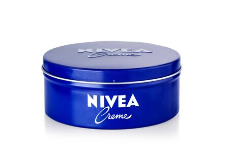 Chisinau, Moldova March 27, 2019:  Nivea Creme, the world's famous skin cream skin cream in a metal jar laid on white background , with clipping pathのeditorial素材