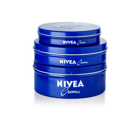 Chisinau, Moldova March 27, 2019:  Nivea Creme, the world's famous skin cream skin cream in a metal jar laid on white background , with clipping pathのeditorial素材