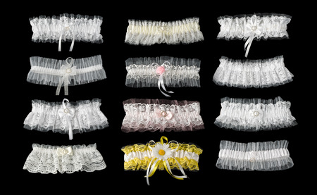 The garters for bride isolated on black background