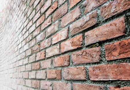 Old brick wall texture with narrow depth of fieldの写真素材
