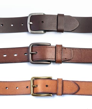 leather belt isolated on white background. Men`s belt. Leather belt with metallic claspの写真素材