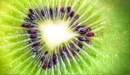 Slice of fresh juicy delicious and healthy kiwi fruit, close upの写真素材