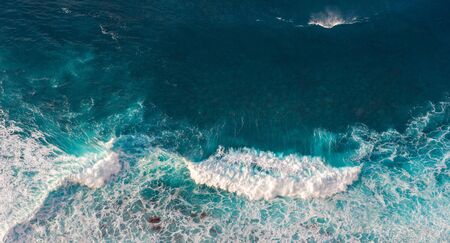 Aerial view to waves in ocean Splashing Waves. Blue clean wavy sea water.の写真素材