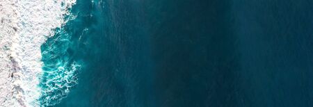 Aerial view to waves in ocean Splashing Waves. Blue clean wavy sea water.