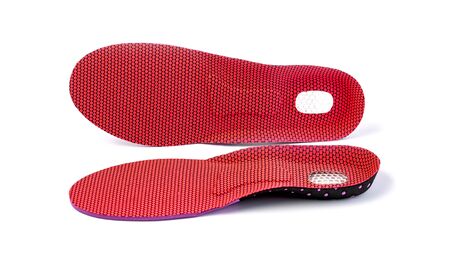 Orthopedic insoles for athletic shoes on a white backgroundの写真素材