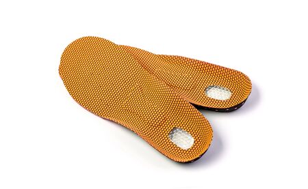 Orthopedic insoles for athletic shoes on a white background