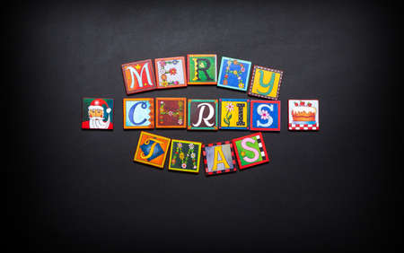 Christmas and New Year typographical on black board backgroundの写真素材