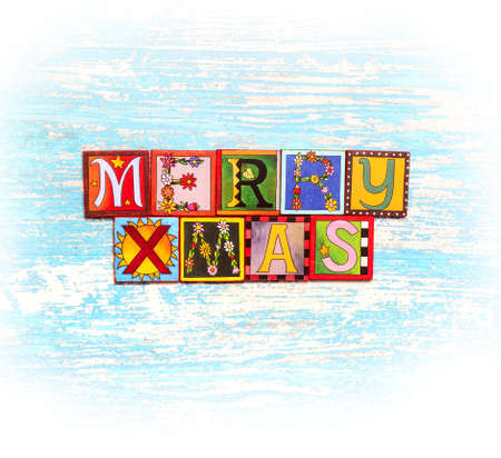 Christmas and New Year typographical on light wooden background