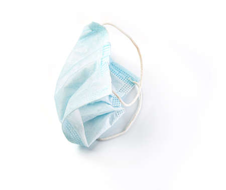 Used blue medical surgical mask, Medical protective mask on white background.