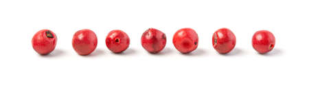 Red peppercorns isolated. Peppercorn on white background. Pepper macro. Full depth of field.の写真素材