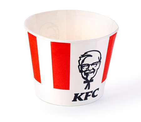 Chisinau, Moldova September 01, 2021: A Bucket of KFC Chicken. Initially Kentucky Fried Chicken, founded by Harland Sanders, the fast food restaurant chain is now owned by Yum! Brands.のeditorial素材