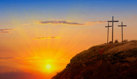 Easter morning, Golgotha hill with silhouettes of the cross, Resurrection background with sunlight, abstract background with copy space for textの写真素材