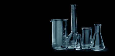 different laboratory glassware for analysis on black background with clipping pathの写真素材