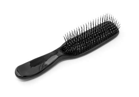 Hair brush with a black handle isolated on whiteの写真素材