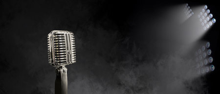 Retro microphone on dark color background with copy spaceの写真素材