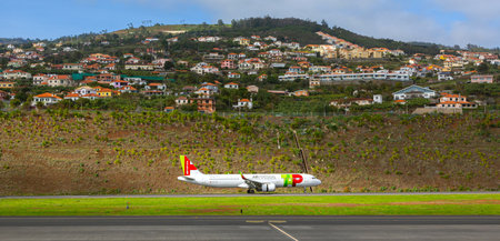 FUNCHAL, PORTUGAL - 31 December 2019: Airplanes docket at Cristiano Ronaldo International Airport at Madeiraのeditorial素材
