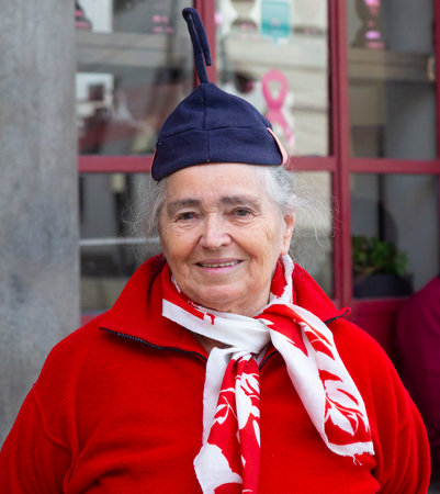 Funchal, Madeira - December 27, 2019:: woman in national clothes is a flower seller at the market mercado dos lavradores Madeira, Portugalのeditorial素材