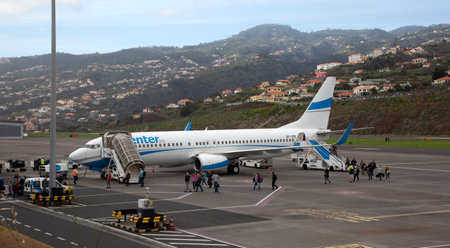 FUNCHAL, PORTUGAL - 31 December 2019: Airplanes docket at Cristiano Ronaldo International Airport at Madeiraのeditorial素材