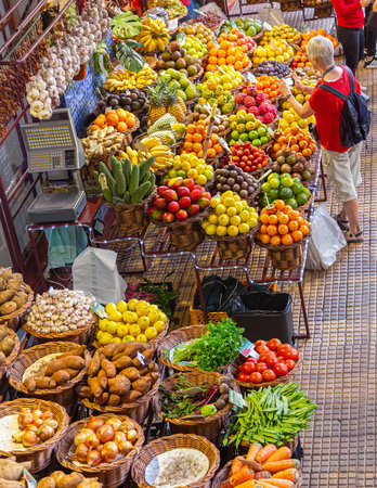 Funchal, Madeira - December 27, 2019:: Unknown people shopping at the vegetable market of the famous Mercado dos Lavradores. Portugalのeditorial素材