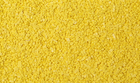 yellow sulfur granules used in medicine, fertilizers. Yellow sulfur background, texture, top view....