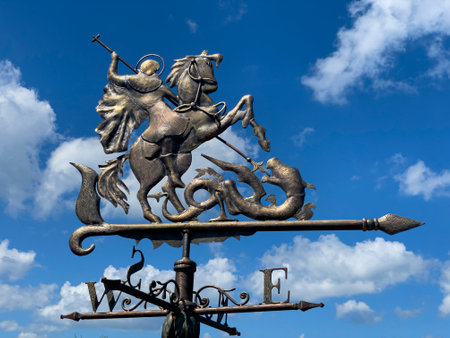 Atamani, Russia, 27 July 2022:Weather vane in the form of St. George the Victorious on sky...