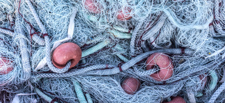Close up view of fishing net. Marine panoramic background.