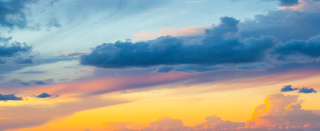 Sunset Sky on Twilight in the Evening with Orange Gold Sunset Cloud Nature Sky Backgrounds, Horizon Golden Sky, Sunrise clouds Gorgeous, Dusk skyの写真素材