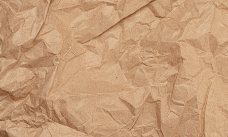 Old crumpled brown paper texture as backgroundの写真素材