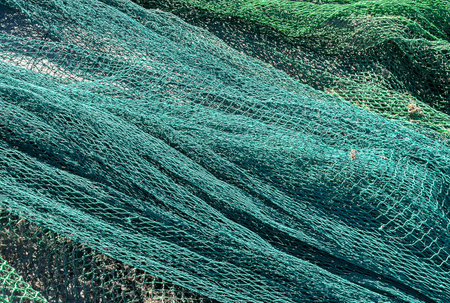 Old fishing net close-up. Texture of an old fishing net.