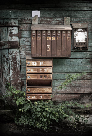 old mailboxes hanging on the wallの写真素材
