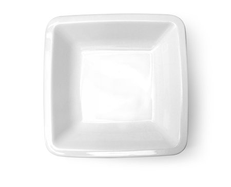 Clean and elegant, an empty white square bowl sits on a white backdrop, ready for culinary creationsの写真素材