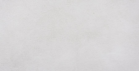 White concrete wall background texture showing rough surfaceの写真素材