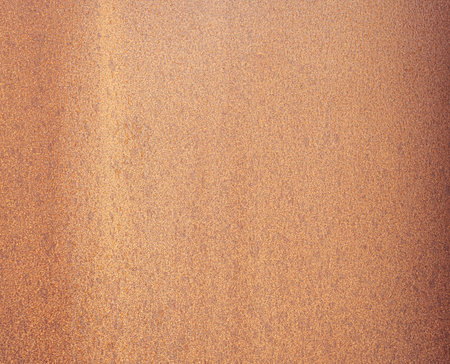 Close-up view of a rusty metal surface exhibiting signs of aging, corrosion, and weathering, suitable for backgrounds and texturesの写真素材