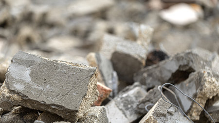 Close-up of broken concrete pieces, highlighting the aftermath of building demolitionの写真素材