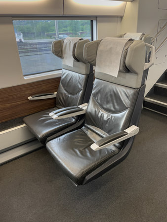 Empty leather seats await passengers on a contemporary high-speed train, offering comfort and style for a relaxing journeyの写真素材
