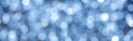 Blurred blue lights creating a festive, magical bokeh background, perfect for holiday designs