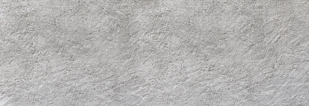 Rough gray concrete wall texture providing an abstract background