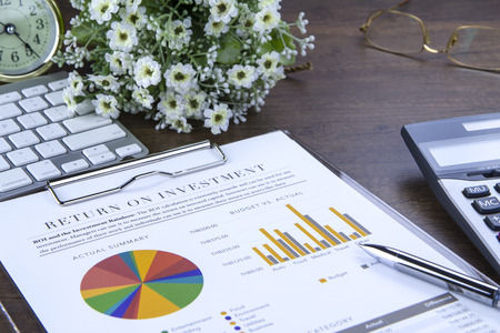 Return on investment analysis document with rainbow pie chart graphの写真素材