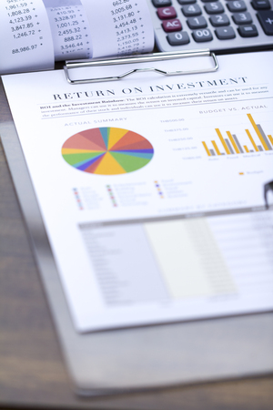 Return on investment analysis document with rainbow pie chart graphの写真素材