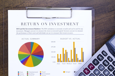 Return on investment analysis document with rainbow pie chart graph and calculator in flat layout