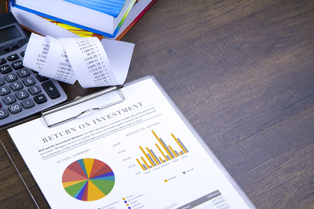 Return on investment analysis document with rainbow pie chart graph and copy space on the right