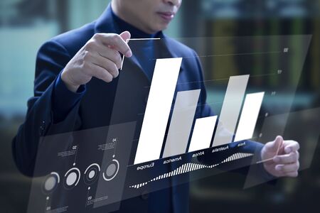 Business man expanding a virtual screen on augmented reality business application with bar graph...