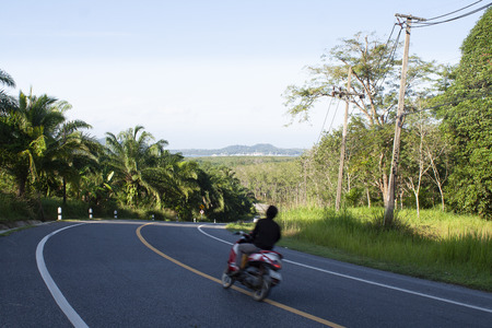 Motorcycle riding on the road.の写真素材