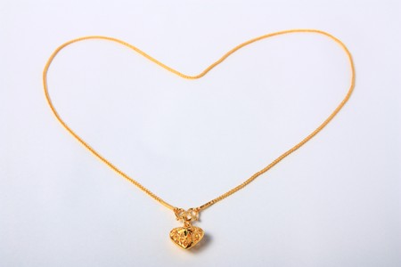 Gold heart pendant with Gold heart necklaceの写真素材